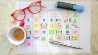 Calendar with business appointments,pens,coffee cup and spectacles, monthly schedule. Business concept,beat the clock.