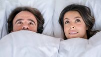 Scared couple in bed
