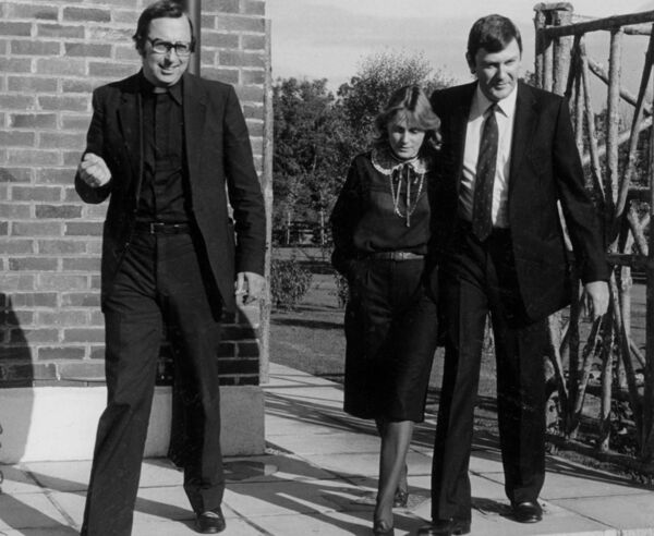 Fr Dermod McCarthy, who negotiated Ben Dunne's release from his IRA kidnappers in 1981, with Mary and Ben Dunne just after were reunited. Picture: Lensmen/Irish Examiner Archive