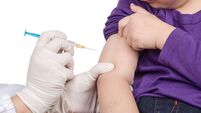 The doctor gave children vaccination needle