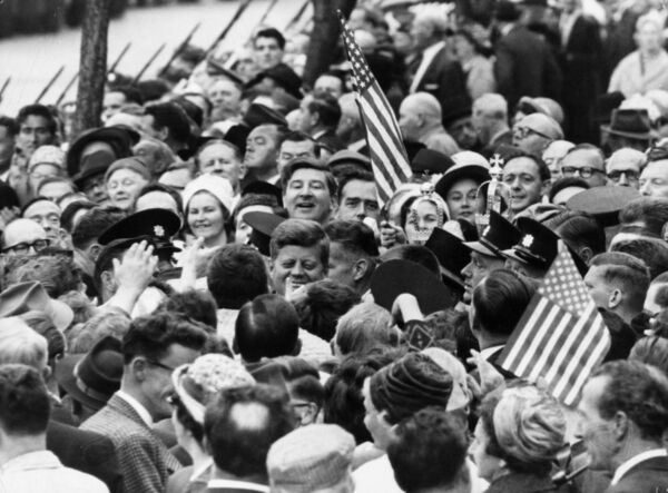 President Kennedy is almost lost among a crowd of well-wishers during his visit to Cork. File picture: Keystone/Getty Images