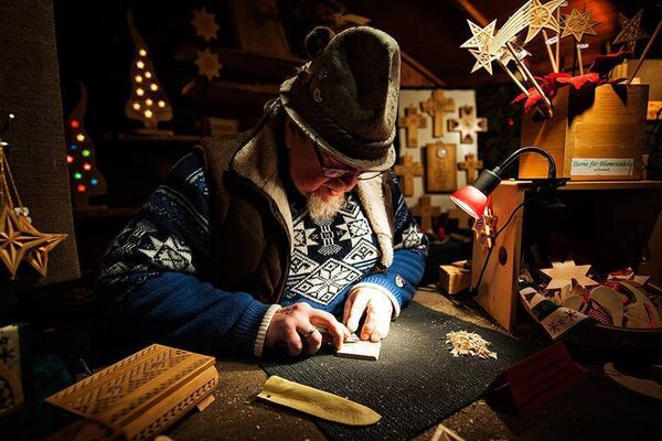 Wood carving at a Christmas market. Photograph: Florian Trykowski. ©DZT/Florian Trykowski 