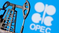 FILE PHOTO: A 3D-printed oil pump jack is seen in front of displayed OPEC logo in this illustration picture