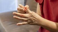 Senior Woman massage finger with painful swollen gout