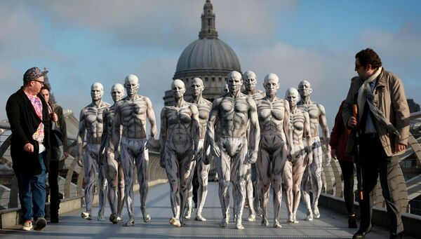 Models who were turned into 'humanoid' robots pose on London's Millennium Bridge to launch the Sky Atlantic television drama 'Westworld' in 2016. Picture: Matt Alexander/PA Wire