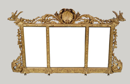  An Irish 19th-century carved giltwood overmantel  at Sheppard's.