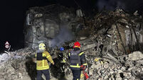 Russian missile strikes in Ukraine bury families in rubble