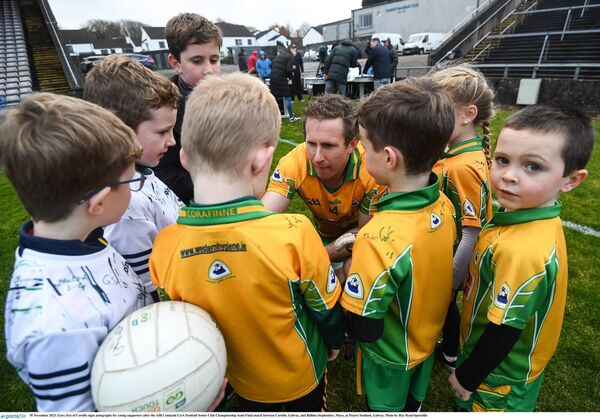 YOUNG AND OLD: Veteran Gary Sice signs autographs for young Corofin supporters after their Connacht semi final win over Ballina Stephenites. Pic: Ray Ryan/Sportsfile