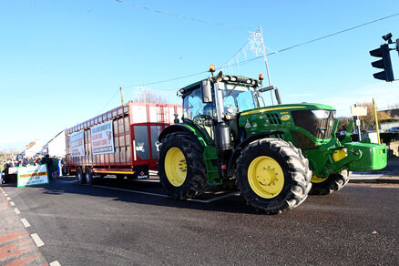  A tractor and trailer leads the march down the main street in Carrigaline. Picture: Larry Cummins