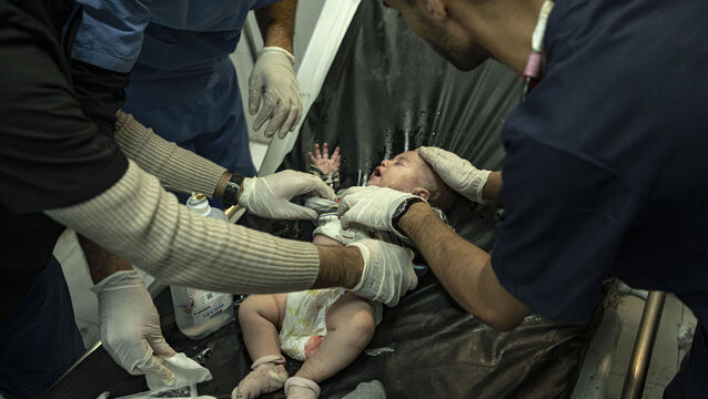 <p>A baby wounded in Israeli bombardment of the Gaza Strip is treated in a hospital in Khan Younis. Hospitals in Gaza are completely overwhelmed. Picture: AP Photo/Fatima Shbair</p>