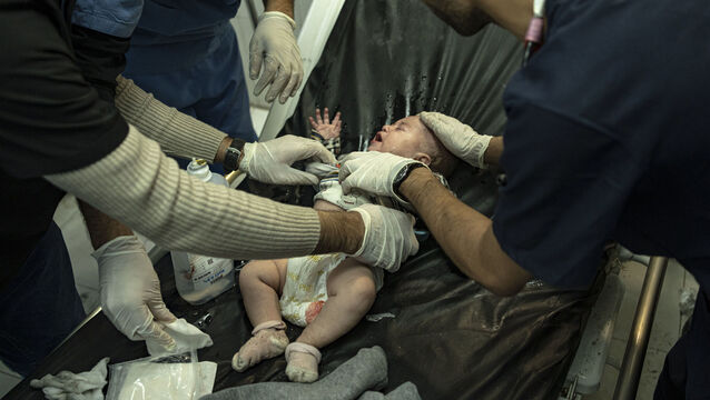<p>A Palestinian baby wounded in Israeli bombardment of the Gaza Strip is treated in a hospital in Khan Younis, Friday. Picture: AP Photo/Fatima Shbair</p>