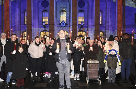 Organiser Nathan Whelan, centre, at the peaceful vigil marking a week since the stabbings. Picture: Conor Ó Mearáin/Collins 