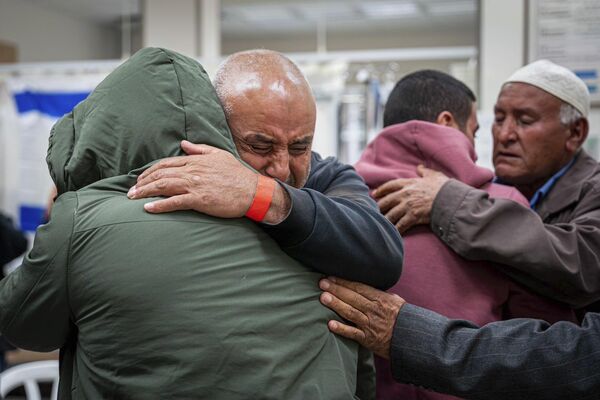 Israeli released hostages siblings Bilal, second right and Aisha Al-Ziyadne, left, reuniting with their family at Soroka Medical Center in Be’er Sheva, Israel. Bilal and Aisha were released the night of Thursday. (Picture: GPO via AP)